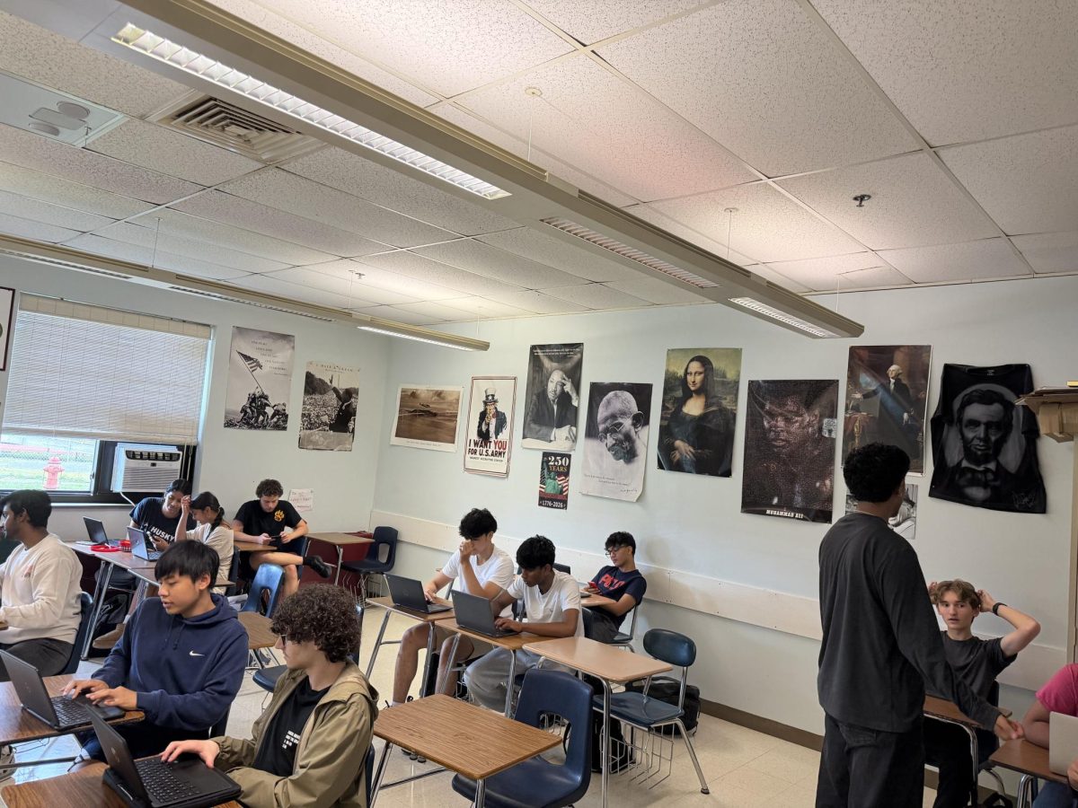 a South Windsor High Schools period 3 social studies class working on projects.