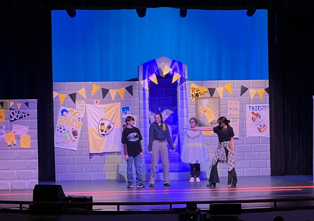 Students in the SWHS theater department performing 'Puffs' on opening night. 