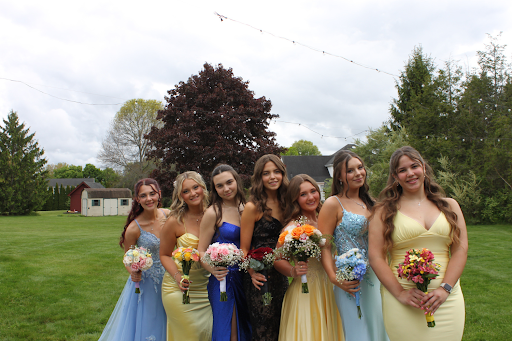 SWHS students Hailey Olints, Sarah Lambert, Kalina Ward, Molly Grohs, Lilliana Girouard, and Emily Attinello pose for prom photos.