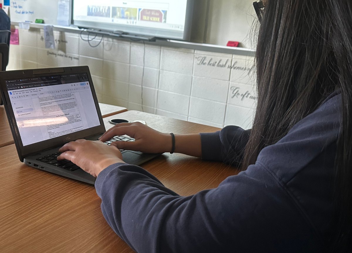 A student working on their film script for their documentary.