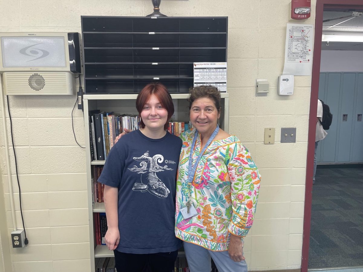 Senior Nico Bennett poses with Mrs. White for a photo after receiving recognition. (photo courtesy of Mrs. Quinn)