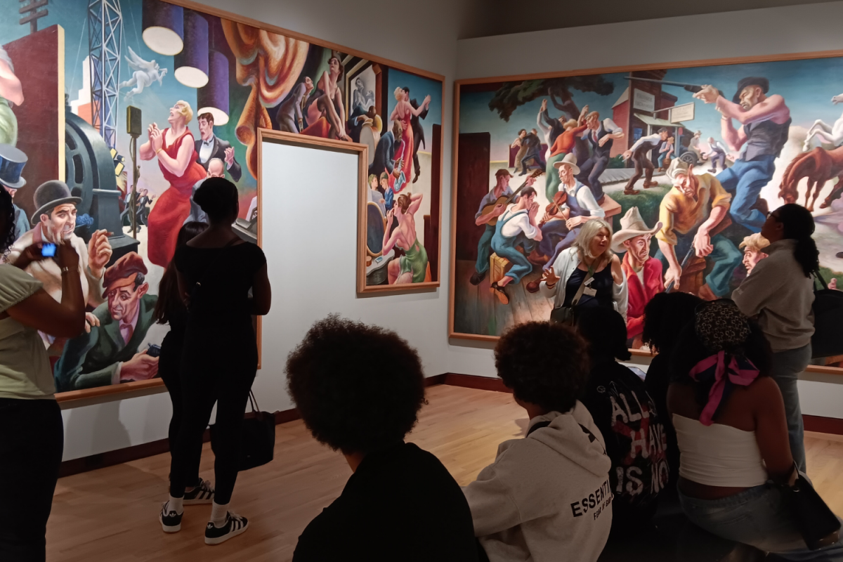 Several members of BSA learn about a Mural representing the great Depression.