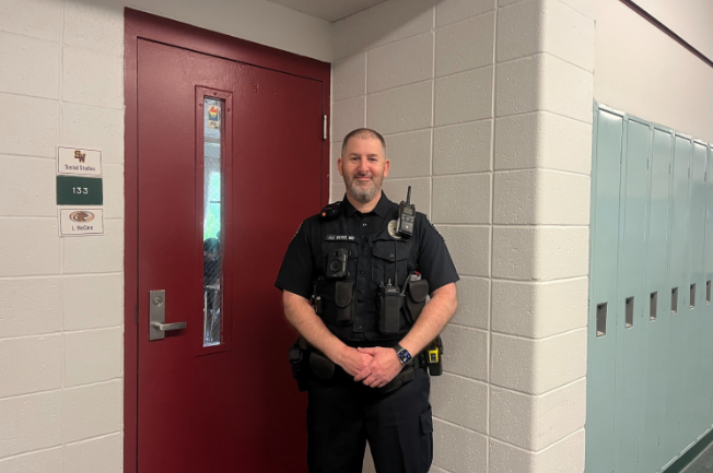 Officer Weiss poses for a photo while patrolling the main floor.