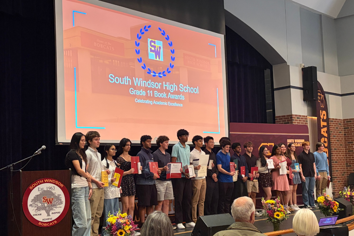 Junior book award recipients pose for a photo to conclude the award ceremony.